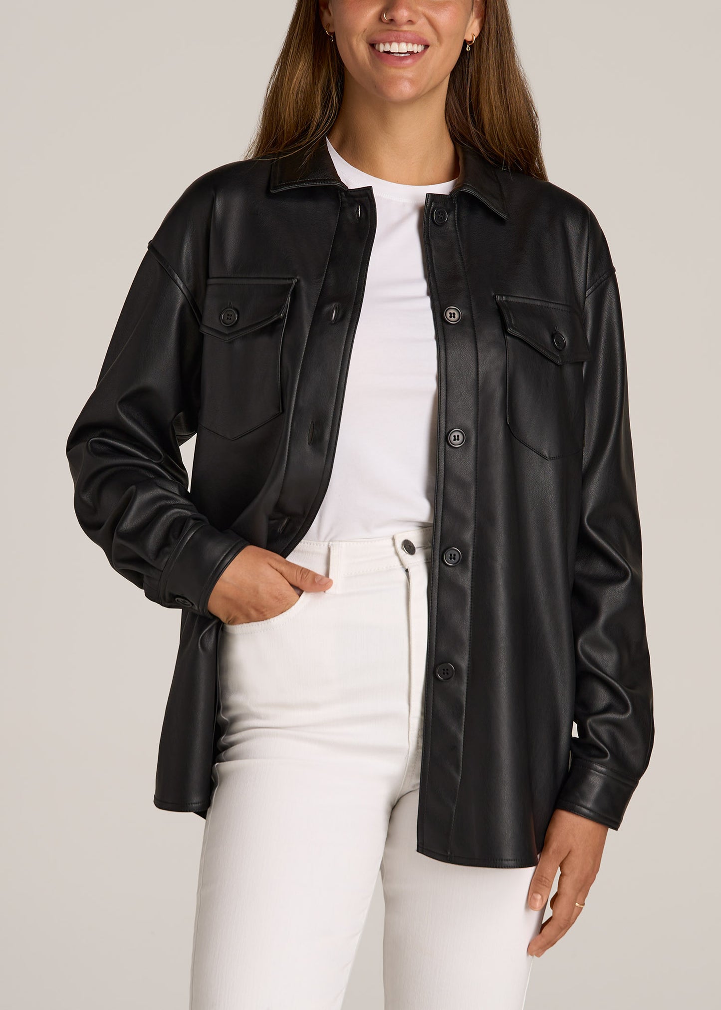 A tall woman wearing American Tall's Faux Leather Shirt Jacket for Tall Women in Black