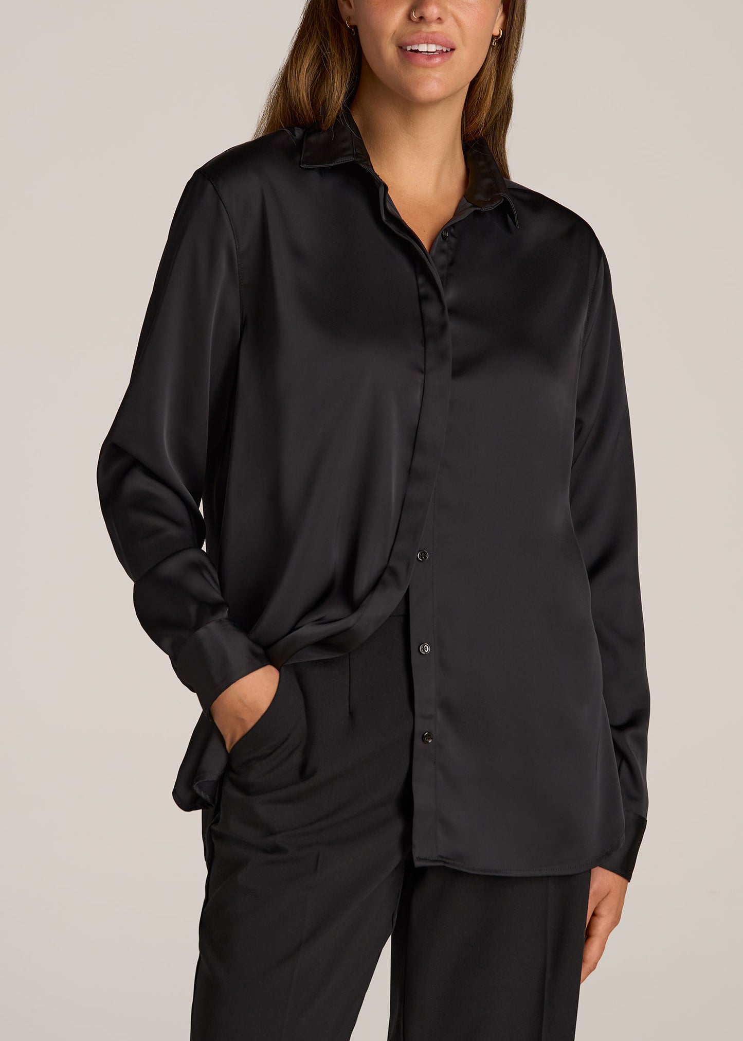 A tall woman wearing American Tall's Relaxed Button Up Tall Women's Blouse in Black