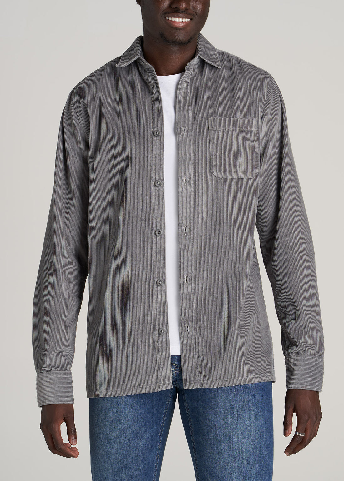 Tall man wearing American Tall's Corduroy Overshirt in Limestone.