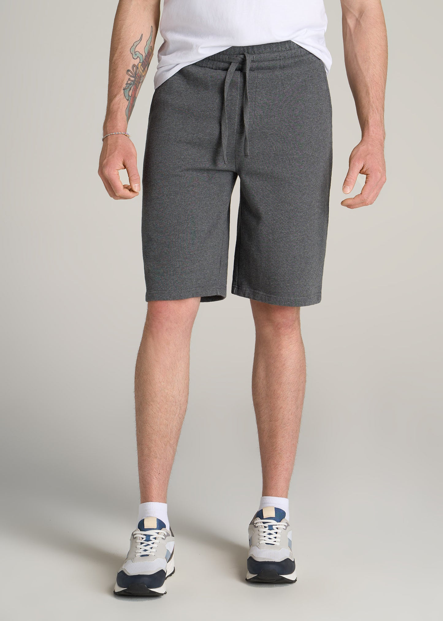 Close-up of a tall man wearing American Tall's Wearever Garment-Dyed French Terry Sweat Shorts in Charcoal Mix.