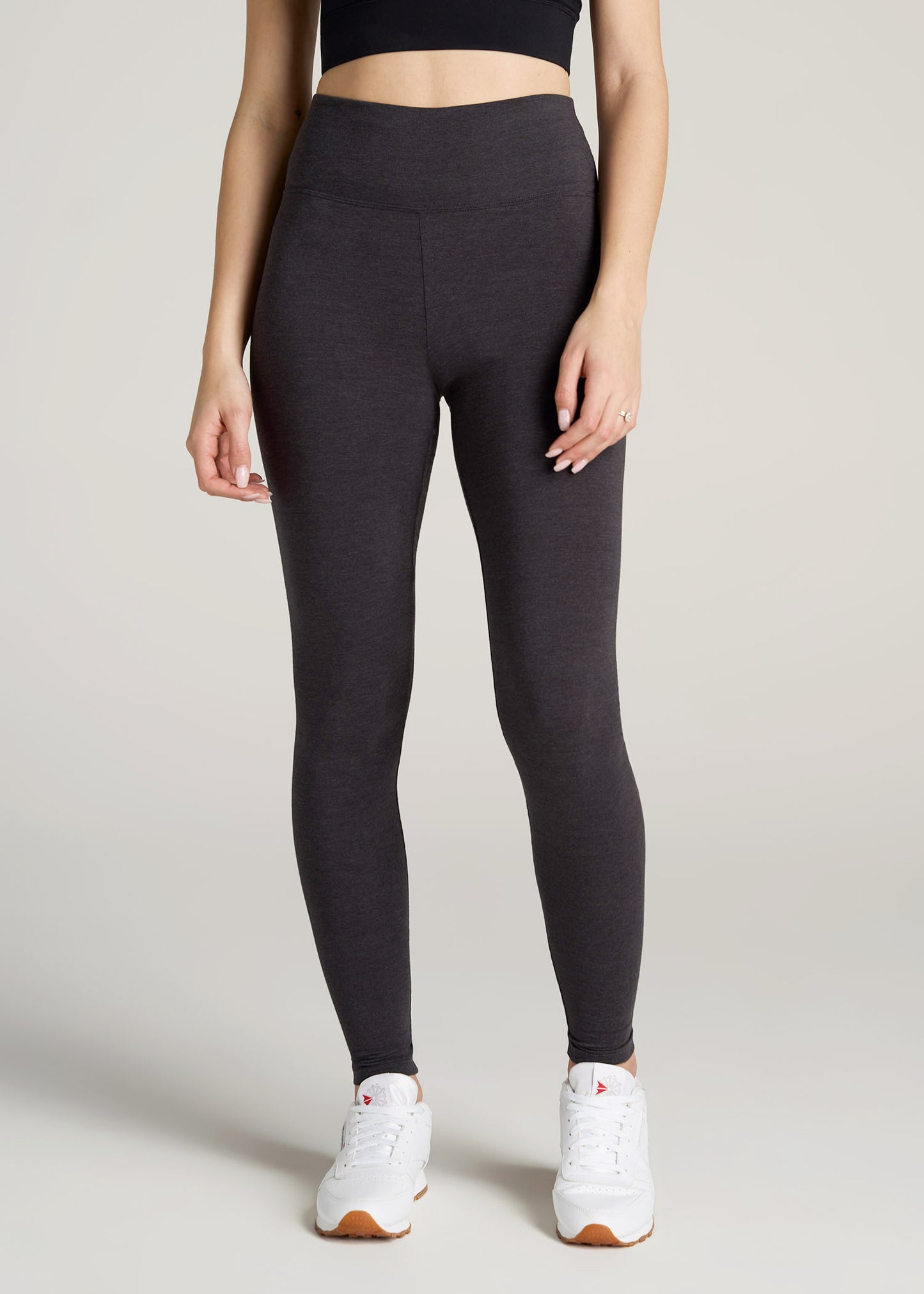 A tall woman wearing American Tall's Women's Tall Cotton Leggings in Shadow Grey Mix