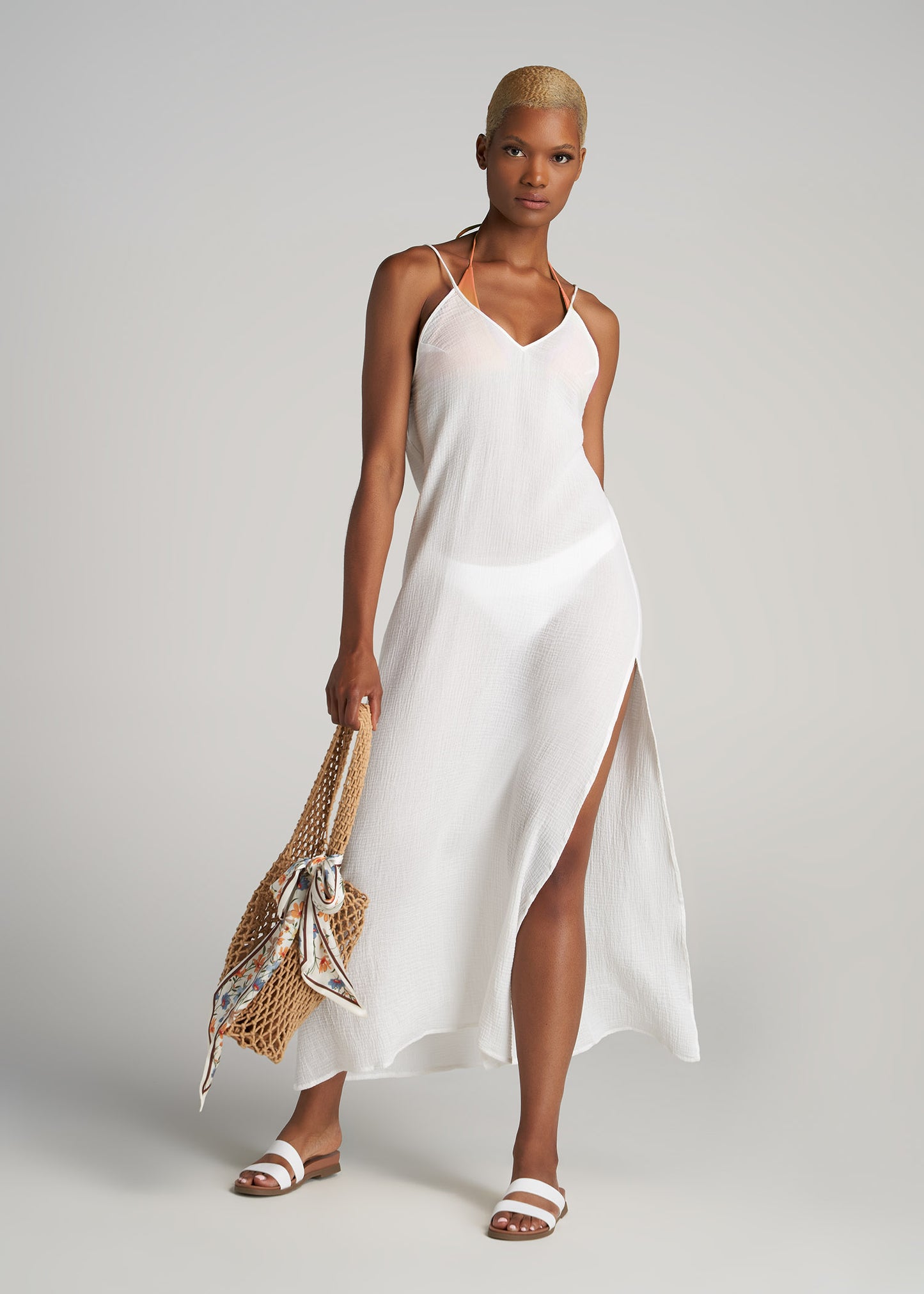 A tall woman wearing American Tall's Cover-Up Gauze Maxi Dress for Tall Women in White