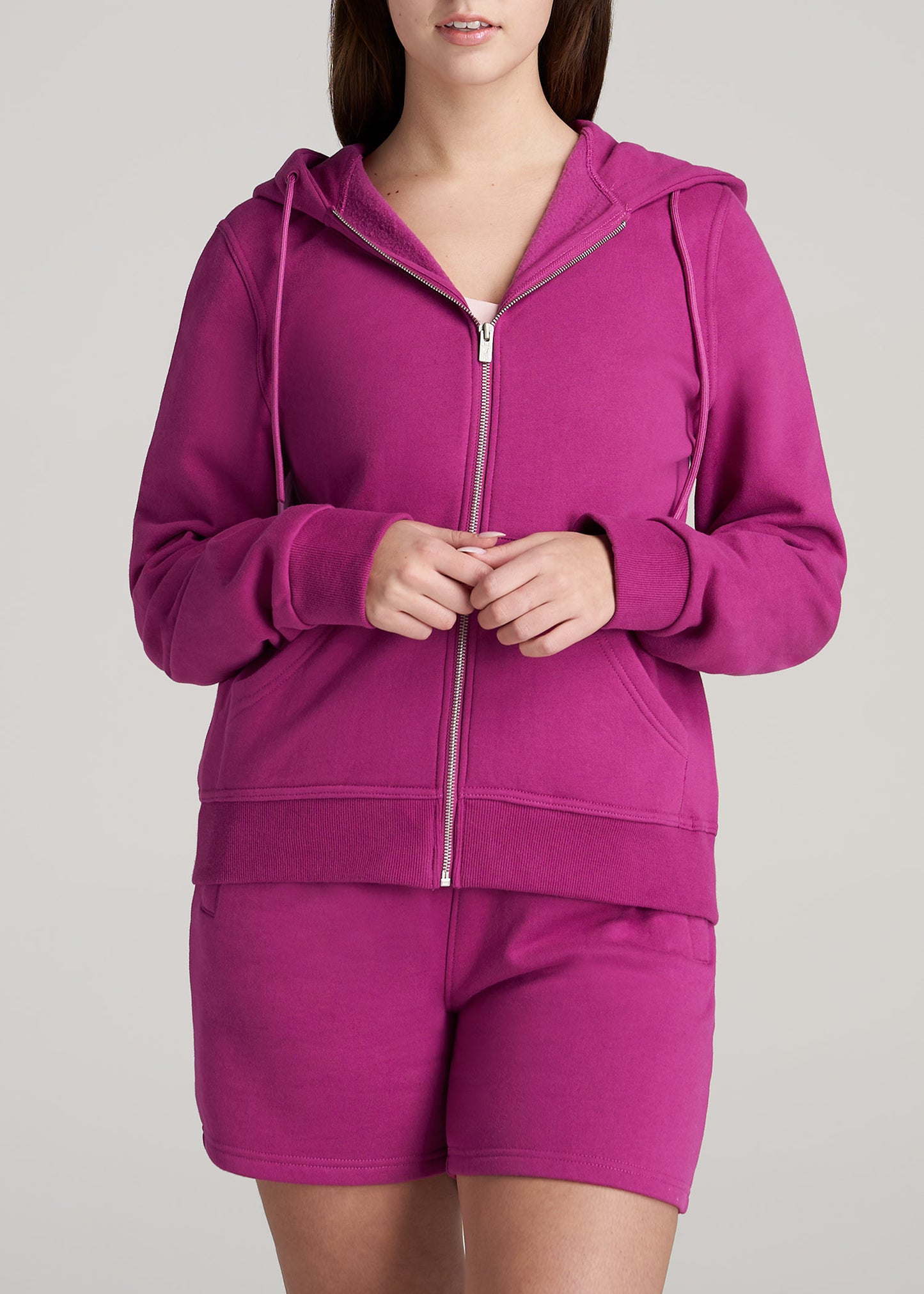 A tall woman wearing Wearever Fleece Full-Zip Women's Tall Hoodie in Pink Orchid from American Tall